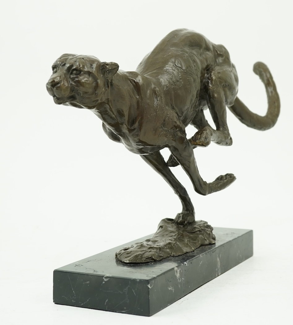 Manner of Mark Coreth (b. 1958): A patinated bronze model of a cheetah in full flight